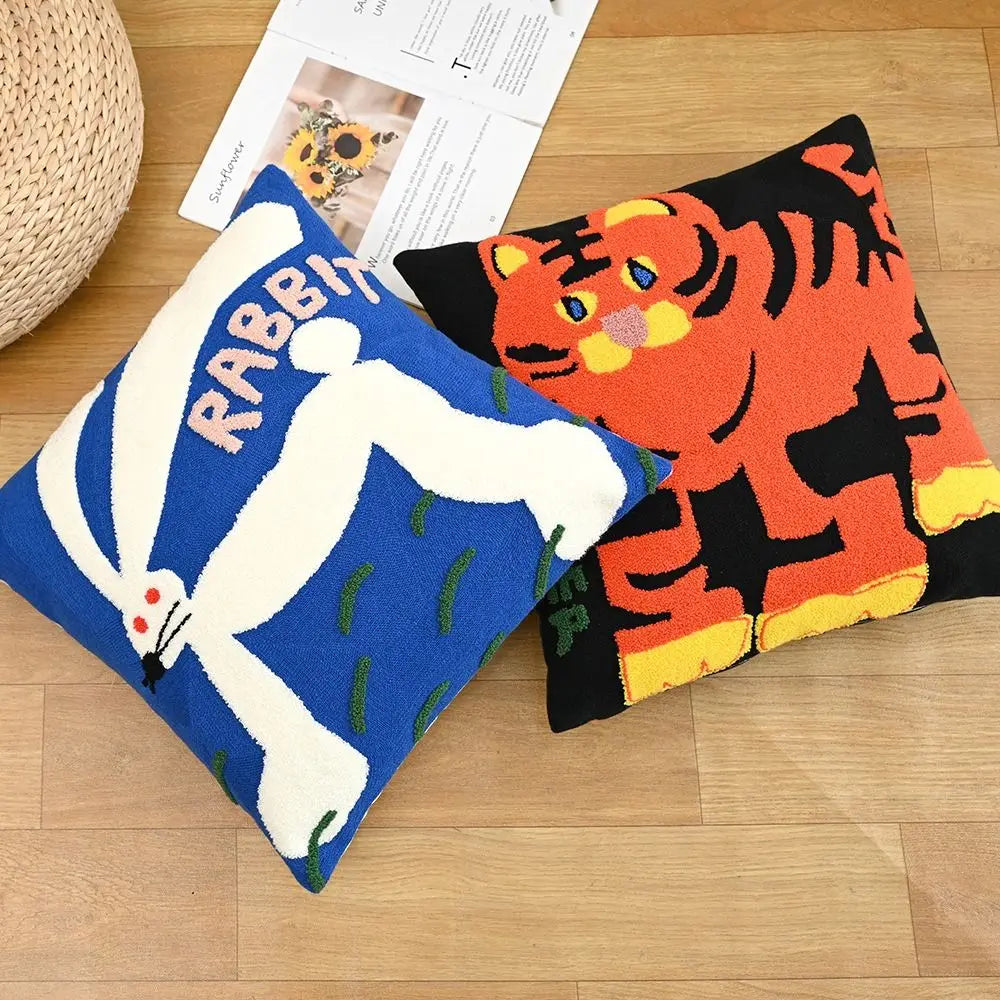 Embroidered tiger on a dark blue 45x45cm cushion; bold jungle motif on rich navy pillow