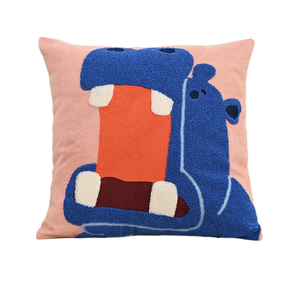 Embroidered hippo pillow in bright blue on a pink background; square cushion with hidden zip, 45x45cm, playful yet grounding home accent.