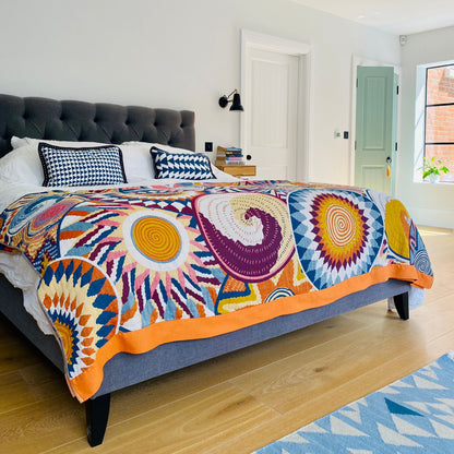 Nordic Lines Throw styled on a bed, offering calming texture and generous drape in a minimalist bedroom setting