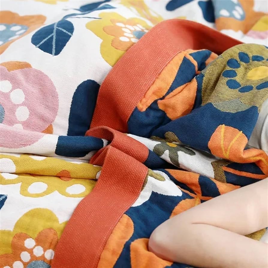 Retro-inspired floral throw blanket with sacred geometry design in warm earthy tones
