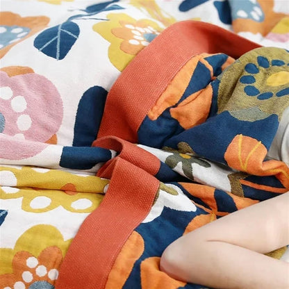 Retro-inspired floral throw blanket with sacred geometry design in warm earthy tones