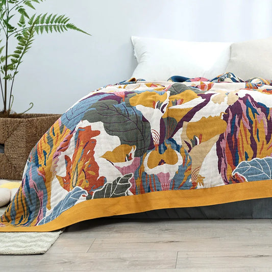Solstice Garden Throw featuring abstract floral and butterfly motifs, adding a golden glow to restful spaces