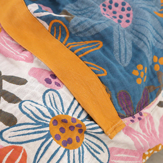 Woven floral linework on textured cotton gauze, showcasing the tactile beauty of non-printed design